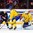 HELSINKI, FINLAND - DECEMBER 28: Sweden's Linus Soderstrom #30 makes a save with Gustav Forsling #8 and USA's Ryan Hitchcock #21 battling in front during preliminary round action at the 2016 IIHF World Junior Championship. (Photo by Matt Zambonin/HHOF-IIHF Images)

